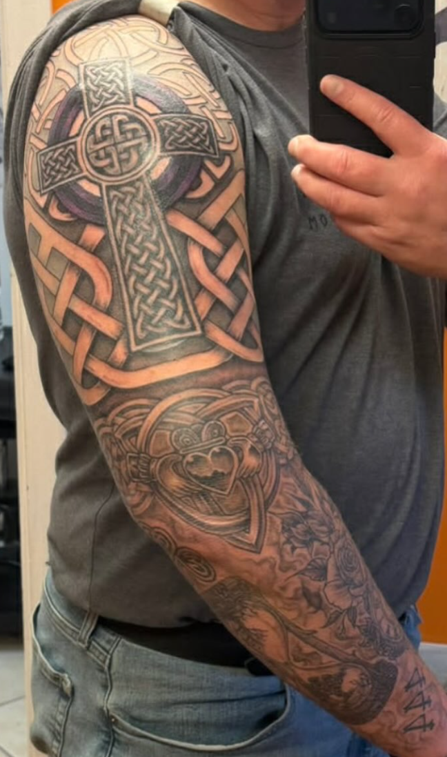 Black-and-grey Celtic cross full sleeve tattoo by Eagle Tattooing West Milford NJ